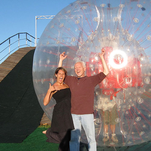 Ride down the hill in a giant ball with our Zorbing rides